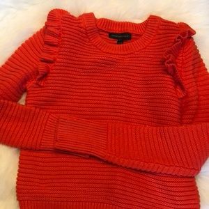 Bright orange sweater